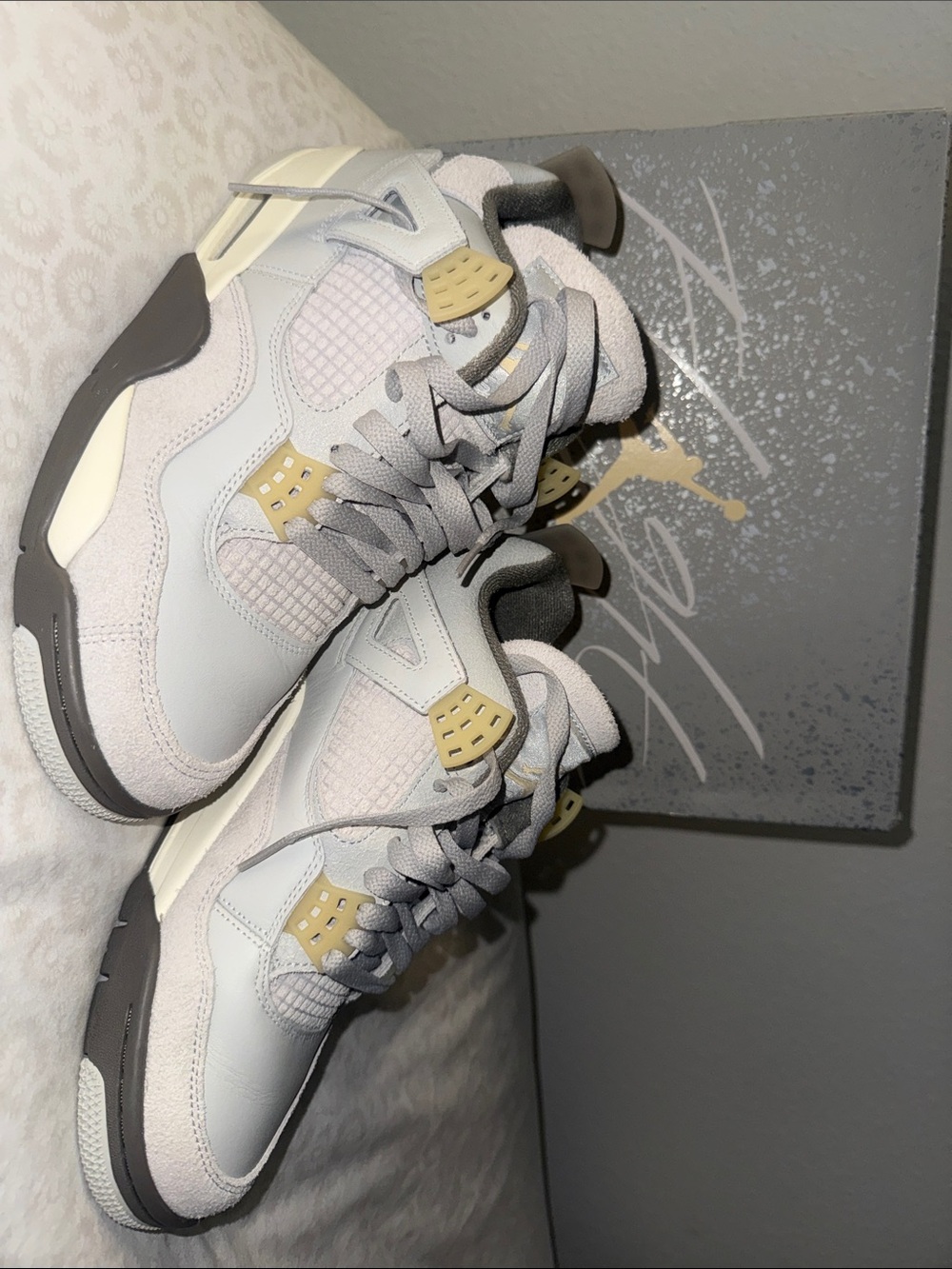 Jordan Retro 4 in Light Grey with Pale Yellow Accents